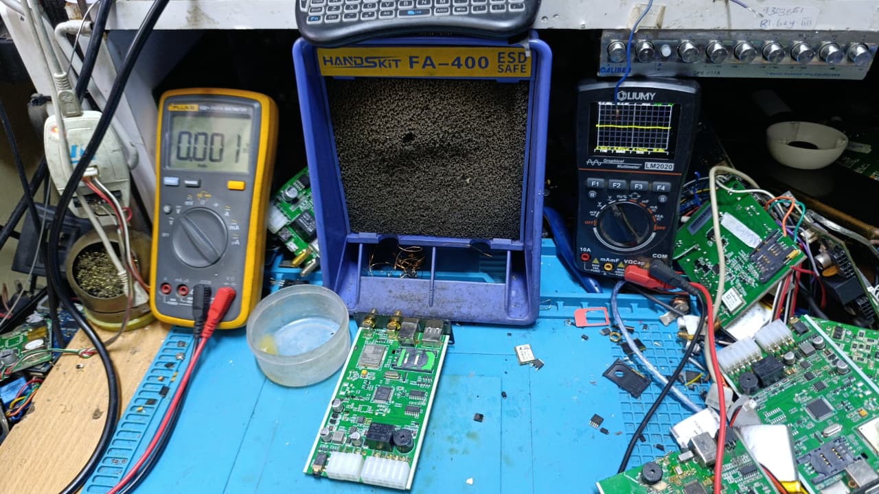 Technician checking a vehicle speed governor module for repair and setup